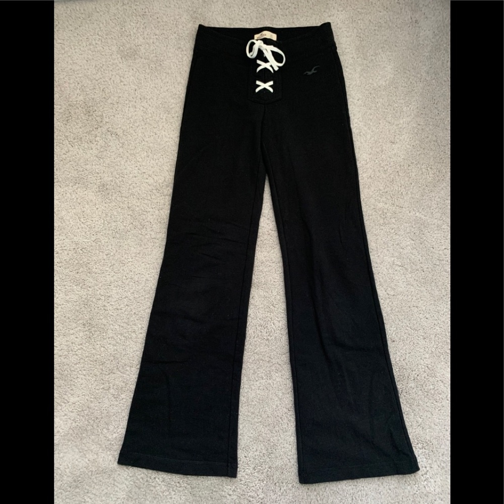 Black flared sweatpants with lace up detail